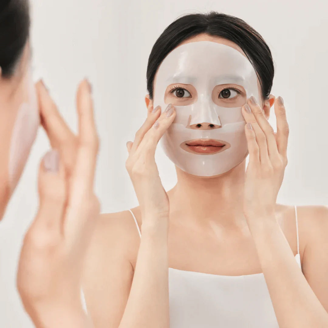 woman with Medicube Collagen Lifting Mask on her face