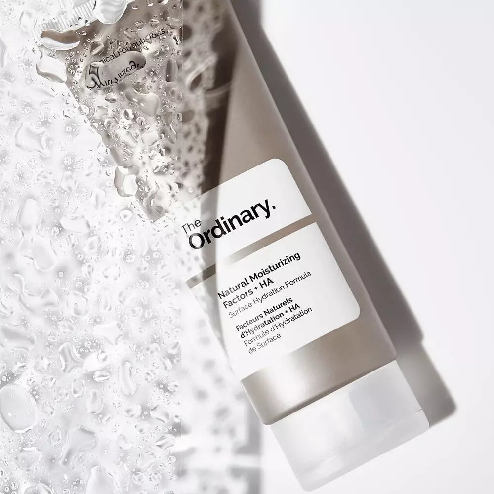 water splashing on The Ordinary Natural Moisturizing Factors + HA bottle
