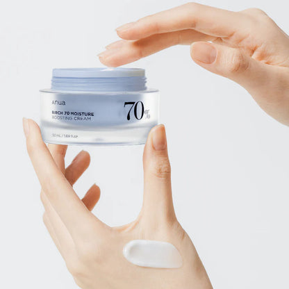 hand holding Anua Birch Moisture Boosting Cream 50 mL