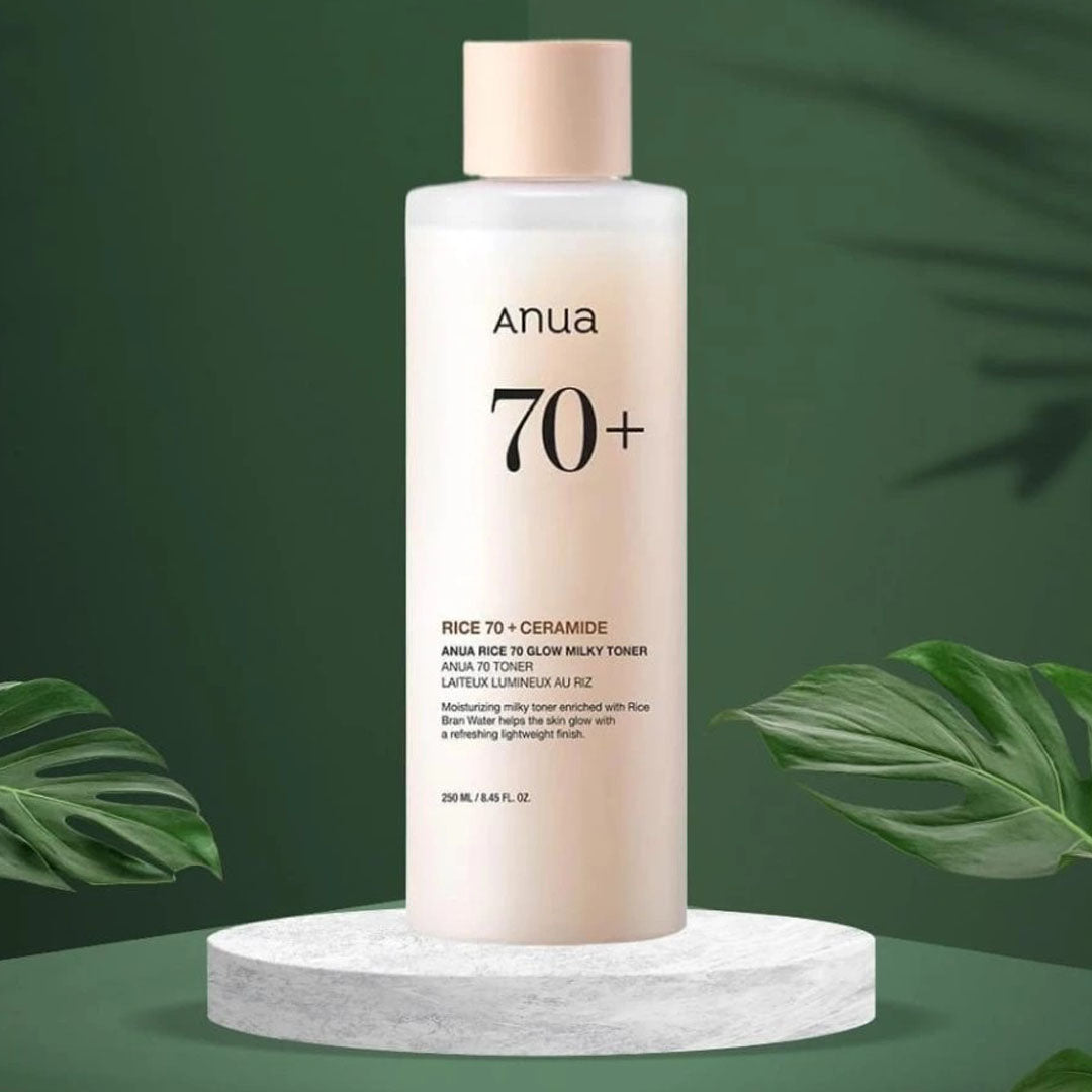 Anua Rice 70 Glow Milky Toner 250 mL bottle on a green background