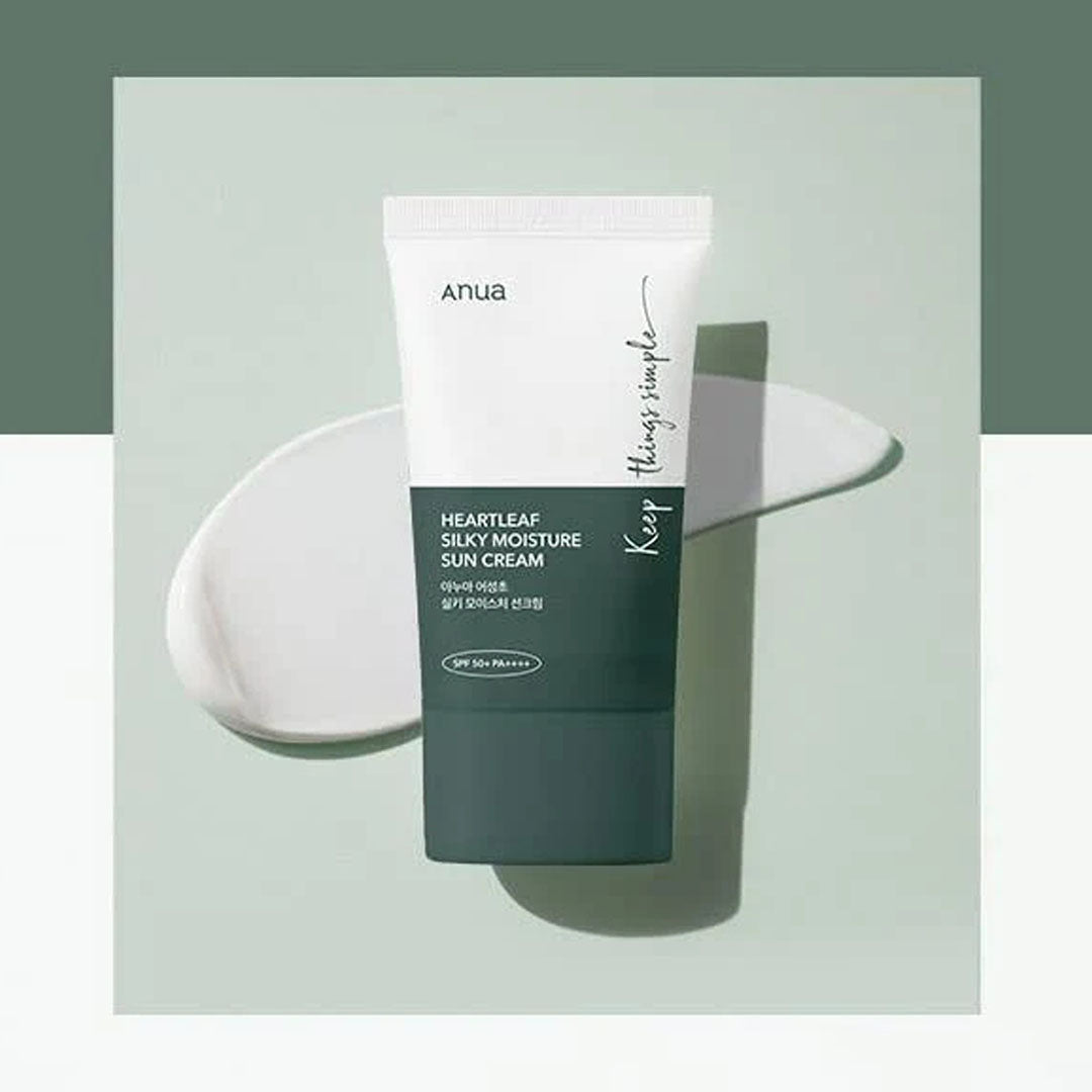 Anua Heartleaf Silky Moisture Sun Cream tube with product swatch in the background