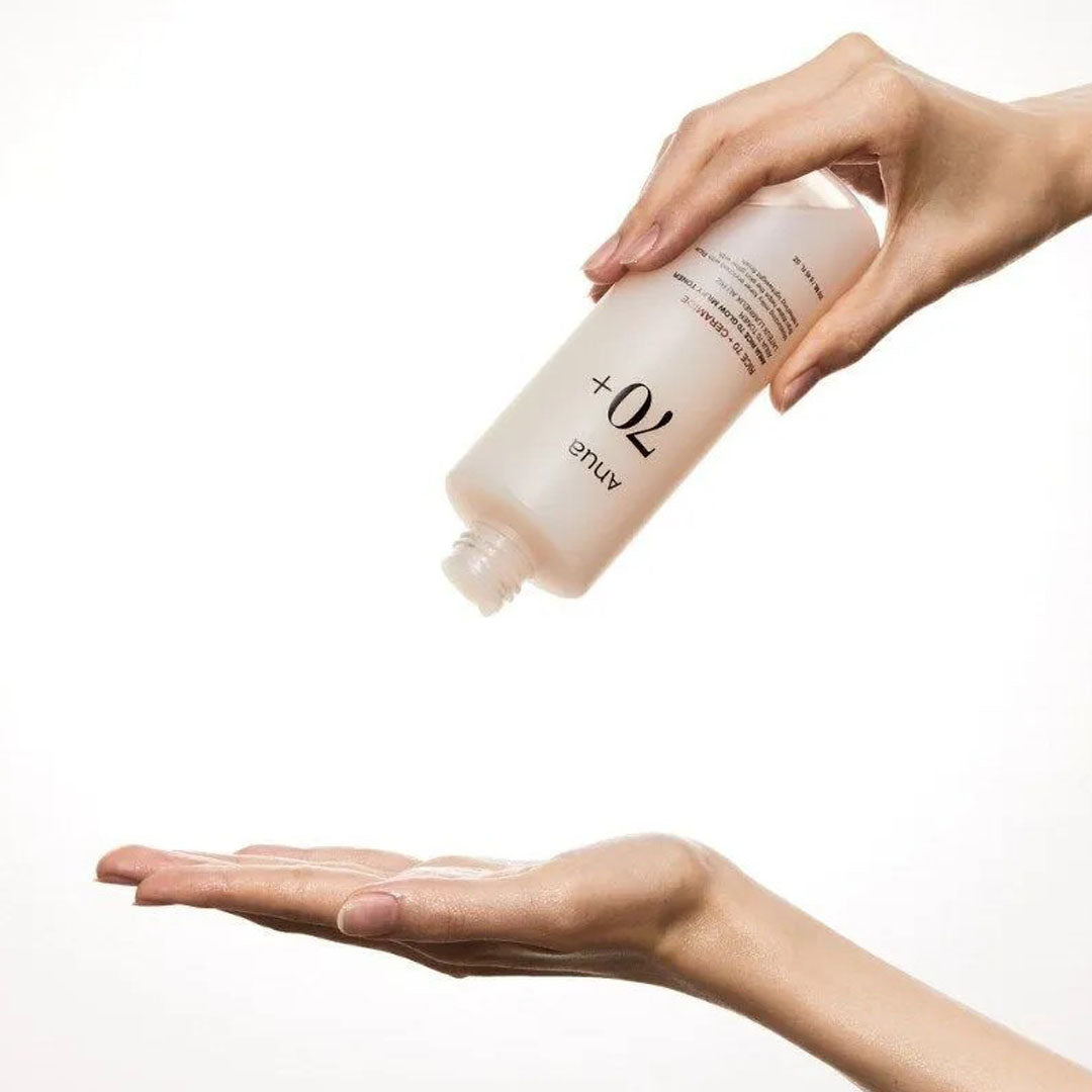 Anua Rice 70 Glow Milky Toner 250 mL dispensed out on hand