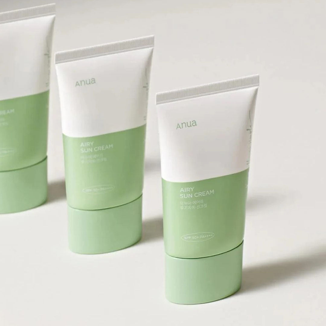 3 Anua Airy Sun Cream Renewed Version tubes placed in line