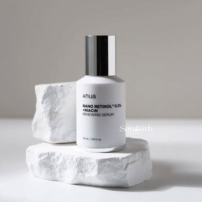 Anua Nano Retinol 0.3% + Niacin Renewing Serum bottle on a white stone