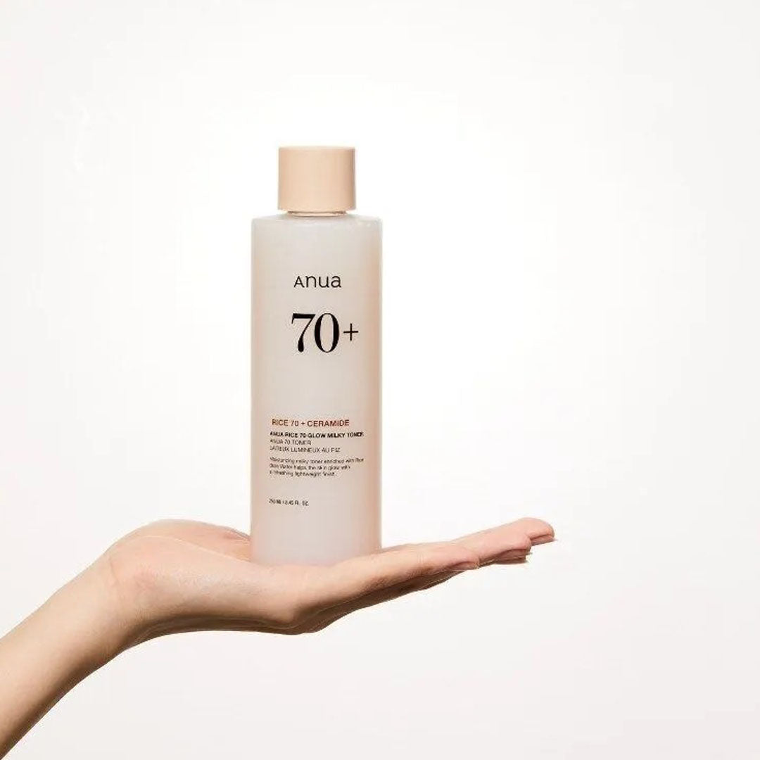 hand holding Anua Rice 70 Glow Milky Toner 250 mL
