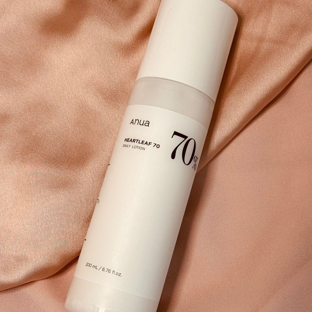 Anua Heartleaf 70% Daily Relief Lotion on a silk surface