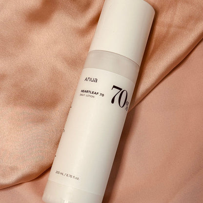 Anua Heartleaf 70% Daily Relief Lotion on a silk surface