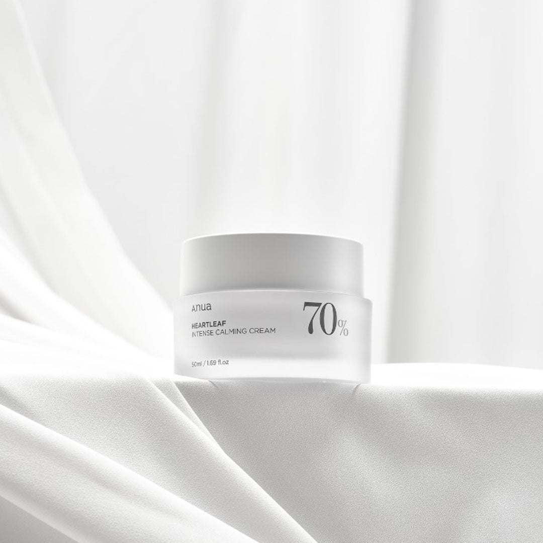a jar of Anua Heartleaf 70 Intense Calming Cream on a white surface