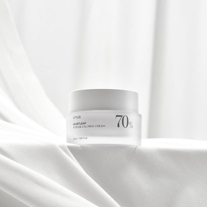 a jar of Anua Heartleaf 70 Intense Calming Cream on a white surface