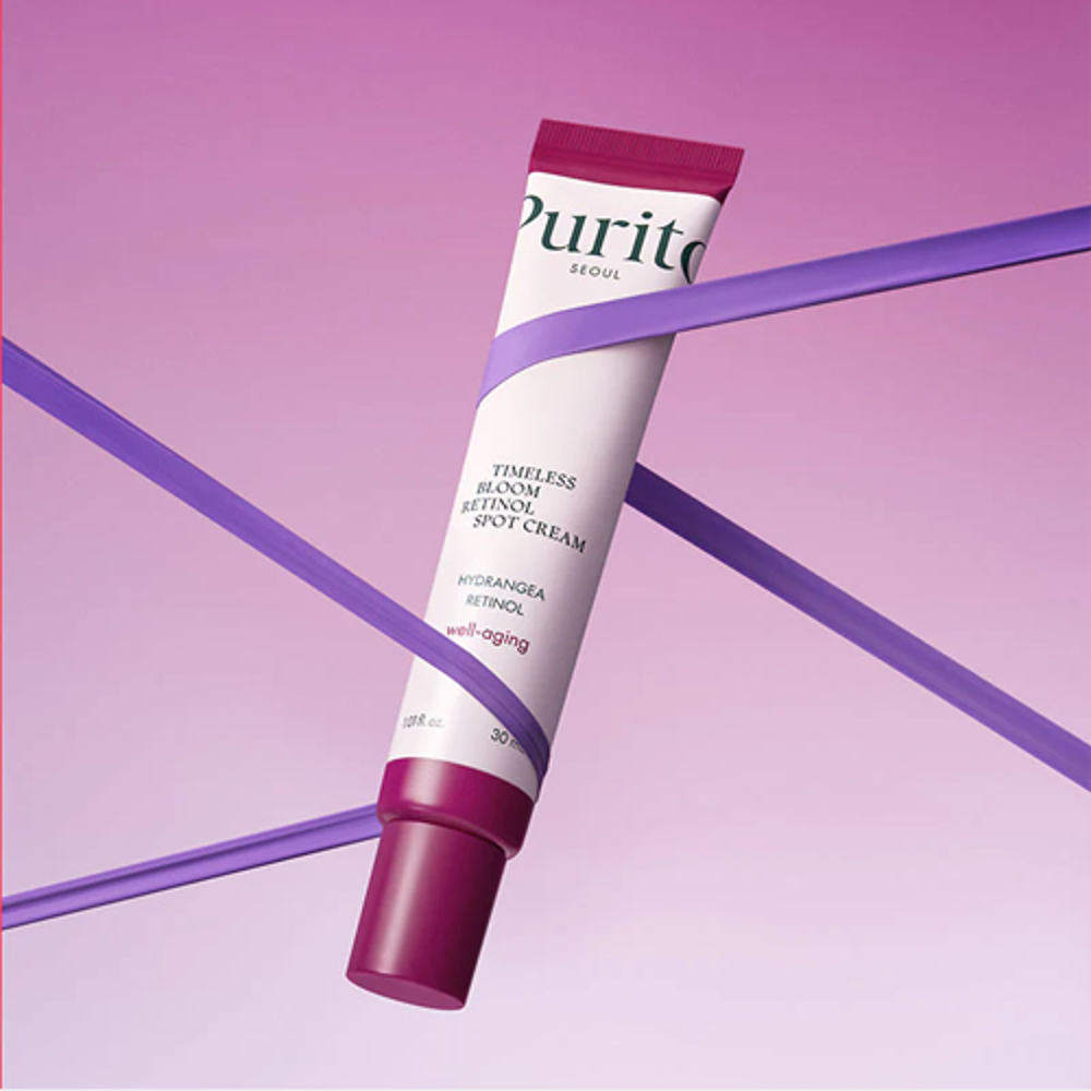 PURITO SEOUL Timeless Bloom Retinol Spot Cream tube wrapped around by two purple strings