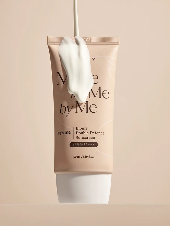 AXIS-Y Biome Double Defense Sunscreen tube lathered in product