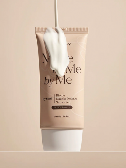AXIS-Y Biome Double Defense Sunscreen tube lathered in product