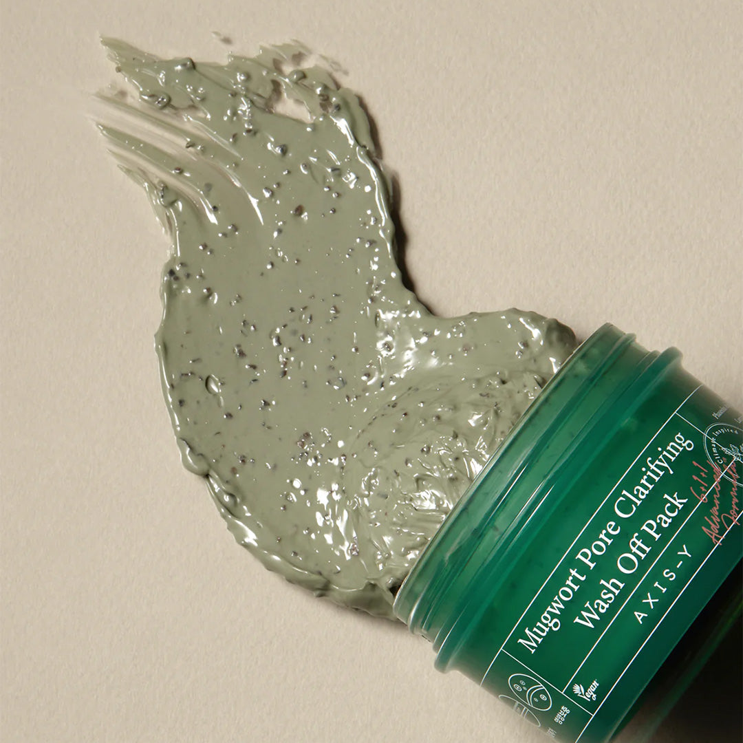 AXIS-Y Mugwort Pore Clarifying Wash Off Pack jar with product spread out on surface