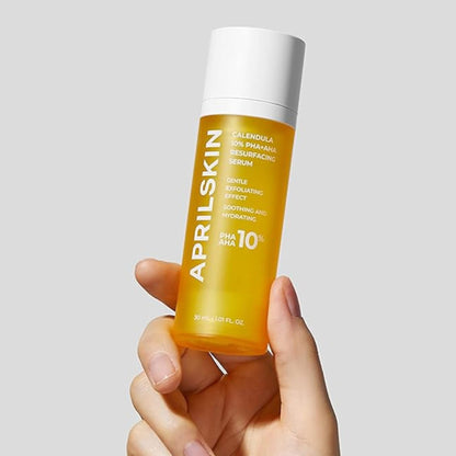 hand holding APRILSKIN Calendula 10% PHA+AHA Resurfacing Serum bottle