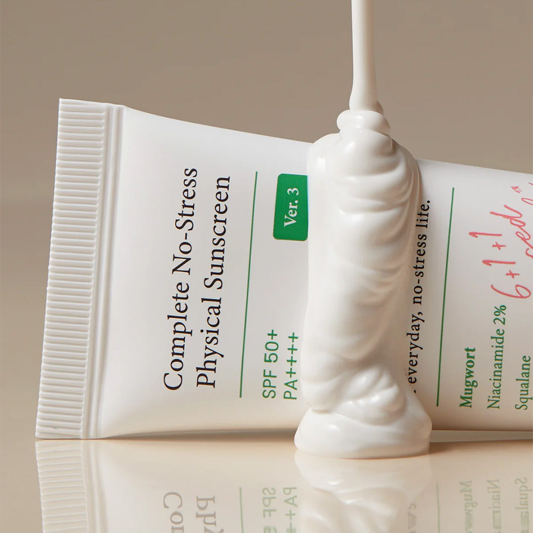 AXIS-Y Complete No-Stress Physical Sunscreen tube lathered in product