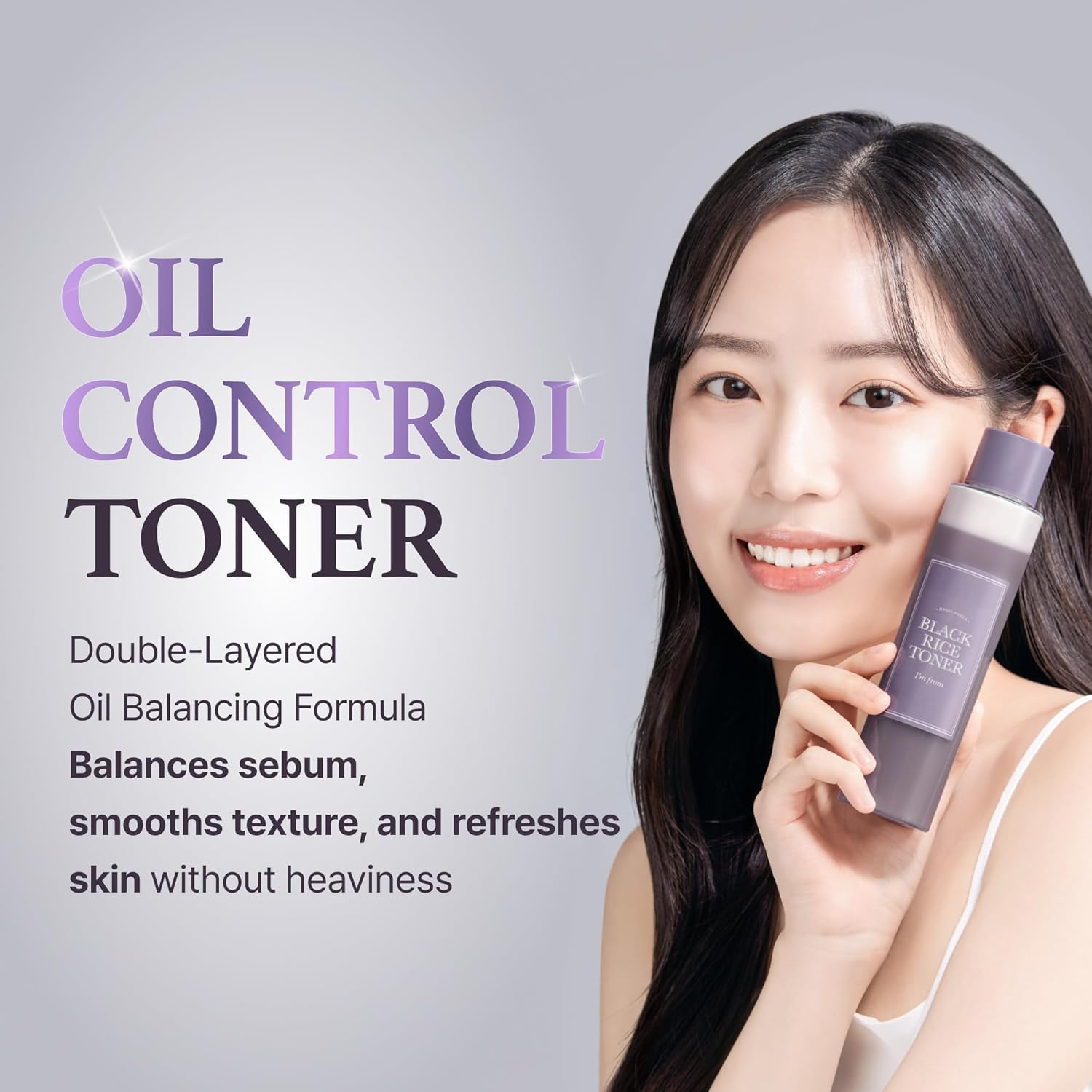 woman holding I'm from Black Rice Toner bottle