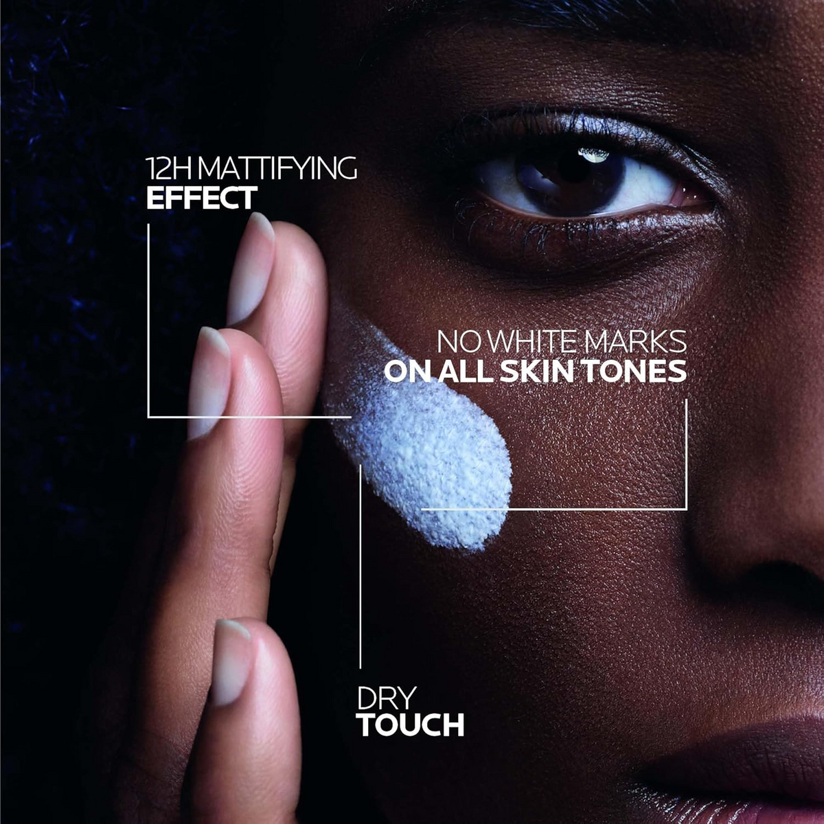 close-up of woman applying LA ROCHE-POSAY Anthelios UVMune 400 Oil Control Invisible Fluid SPF50+ on her cheek 