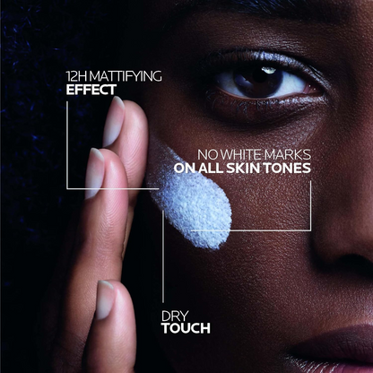 close-up of woman applying LA ROCHE-POSAY Anthelios UVMune 400 Oil Control Invisible Fluid SPF50+ on her cheek 