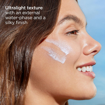 ISDIN Fusion Water Magic SPF50 applied on woman's cheek