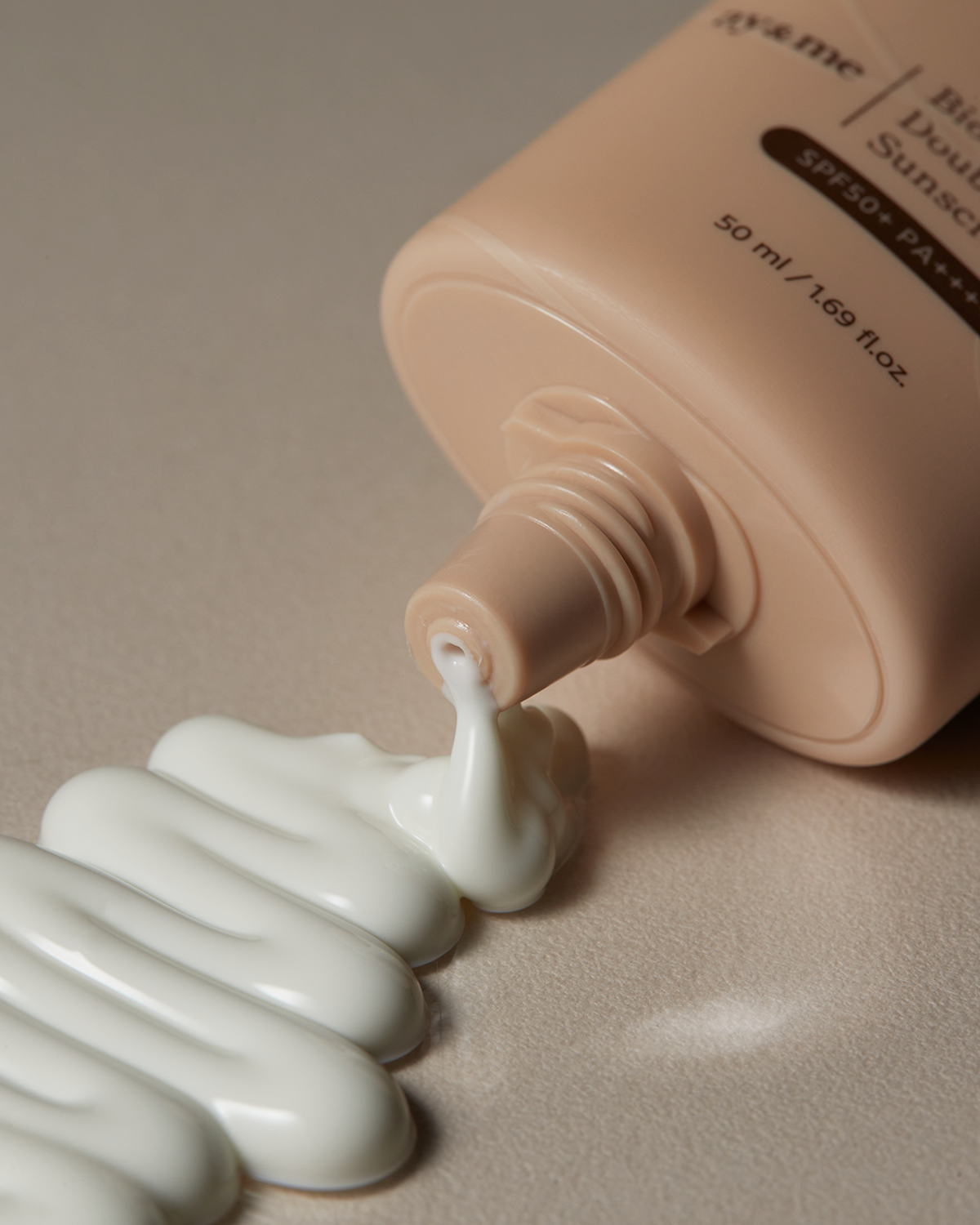 AXIS-Y Biome Double Defense Sunscreen being dispensed out of the tube