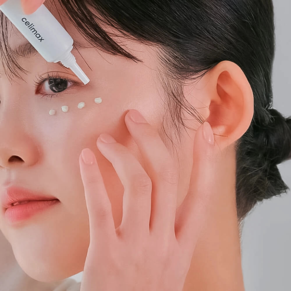 woman applying celimax Noni Ultimate Eye Cream on her under eyes