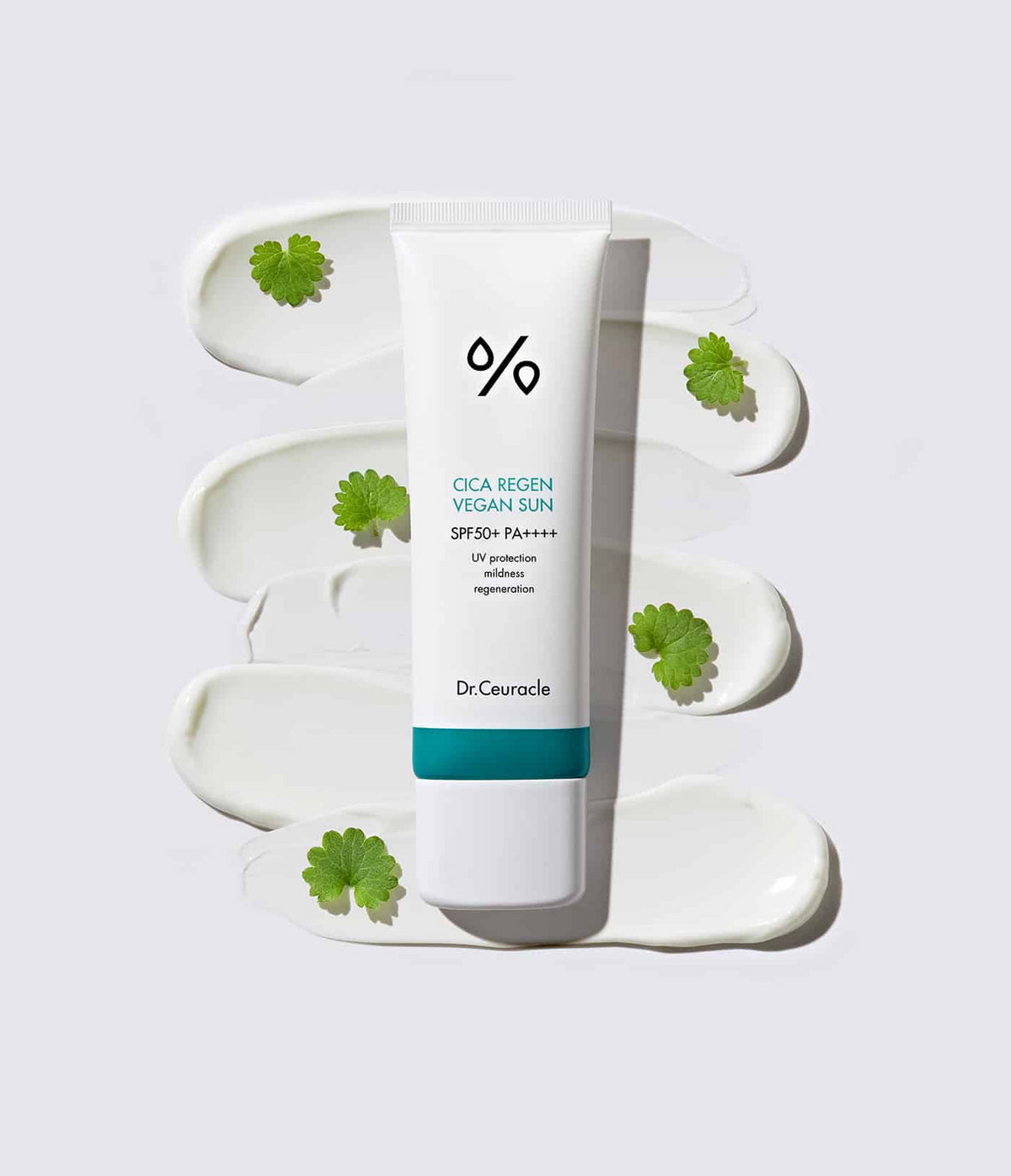 Dr.Ceuracle Cica Regen Vegan Sunscreen tube with multiple product swatches