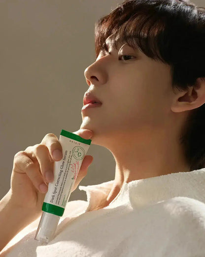 person holding AXIS-Y Vegan Collagen Eye Serum 