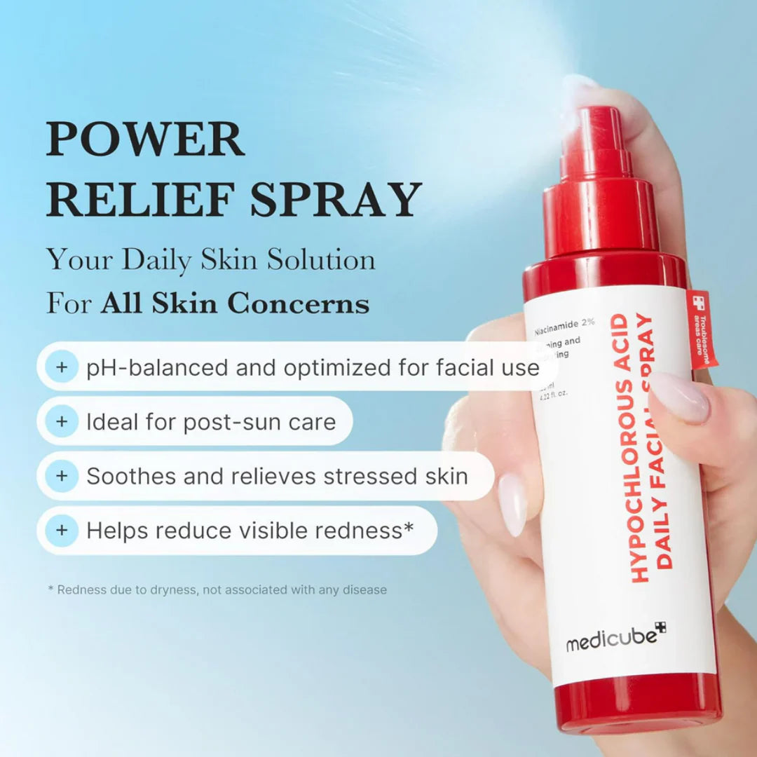 hand holding Medicube Hypochlorous Acid daily facial spray bottle