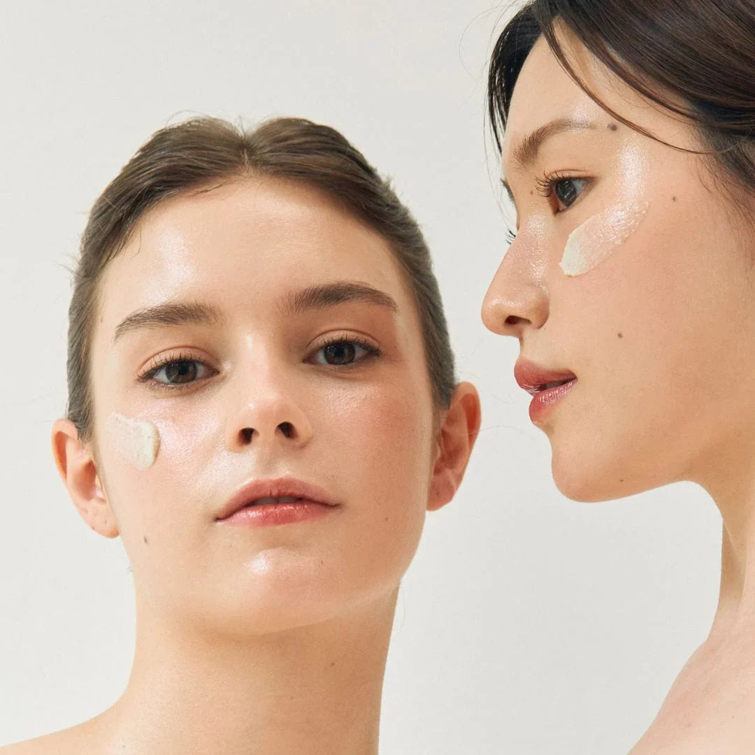 two women with Beauty of Joseon Ground Rice and Honey Glow Mask swatches applied on their cheeks