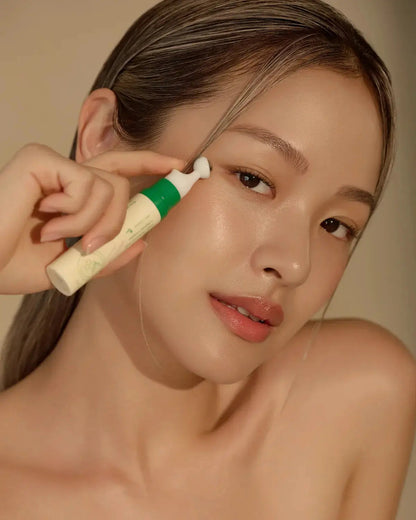 woman holding AXIS-Y Vegan Collagen Eye Serum
