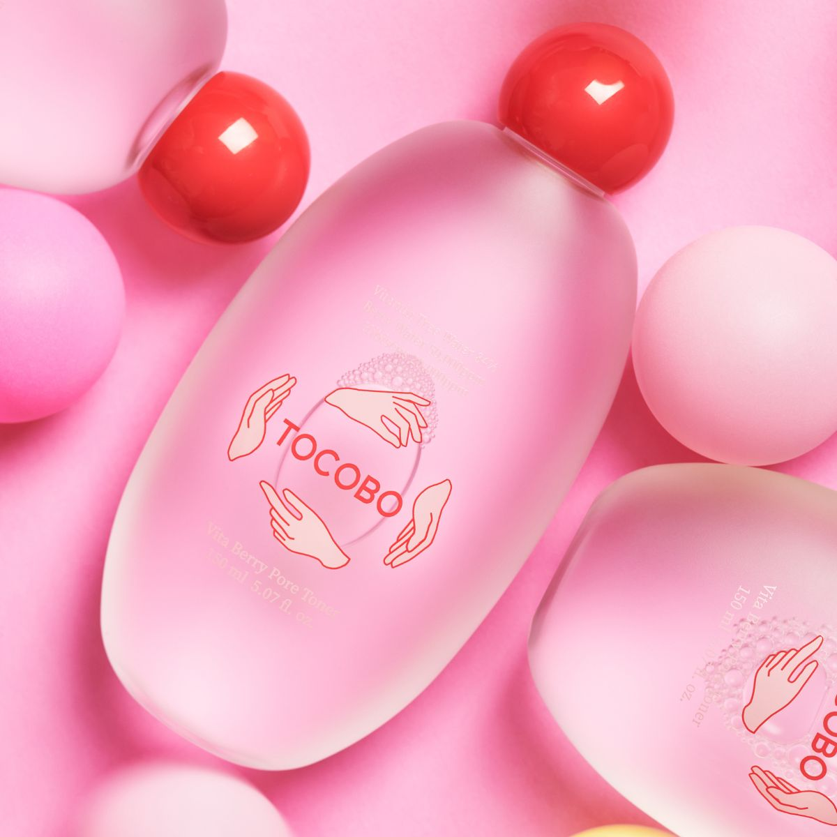 TOCOBO Vita Berry Pore Toner 150mL bottles on a pink surface