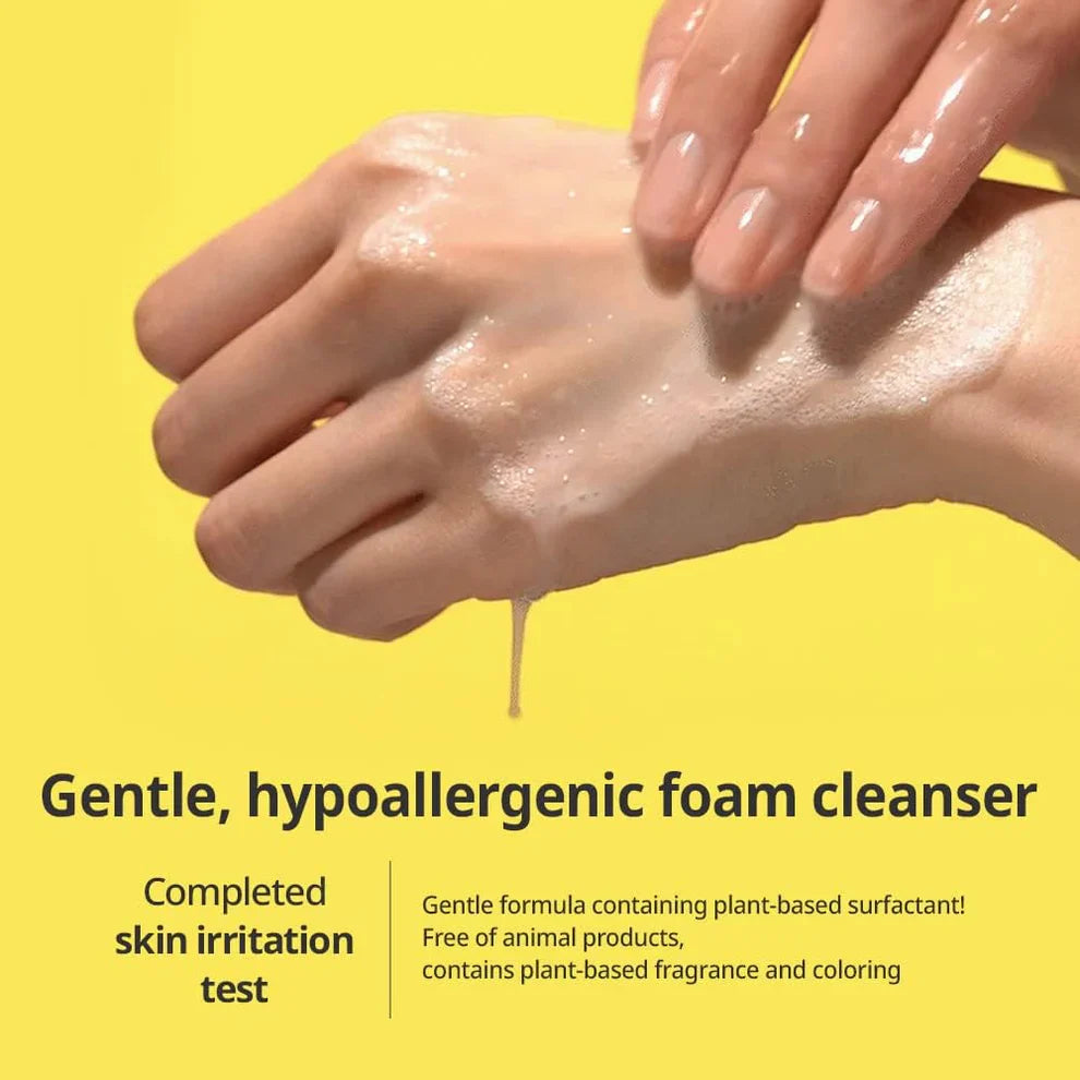 Hand applying Goodal Green Tangerine Vita C Cleansing Foam 