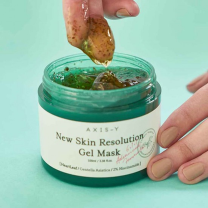hand scooping out Axis-Y New Skin Resolution Gel Mask 