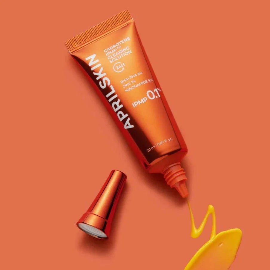 open tube of APRILSKIN Carrotene IPMP Clearing Solution with product dispensed out
